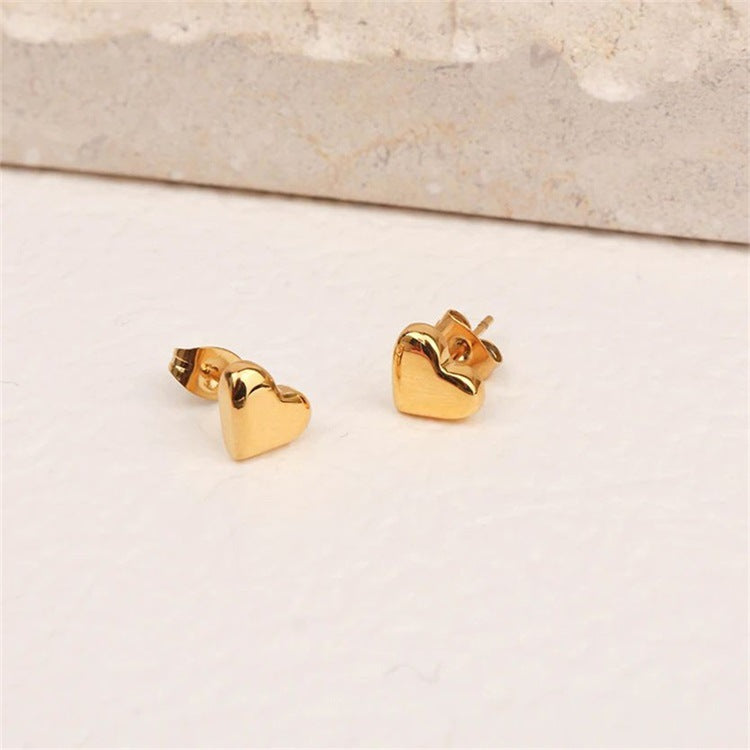 Mila – Pendientes en forma de corazón dorados