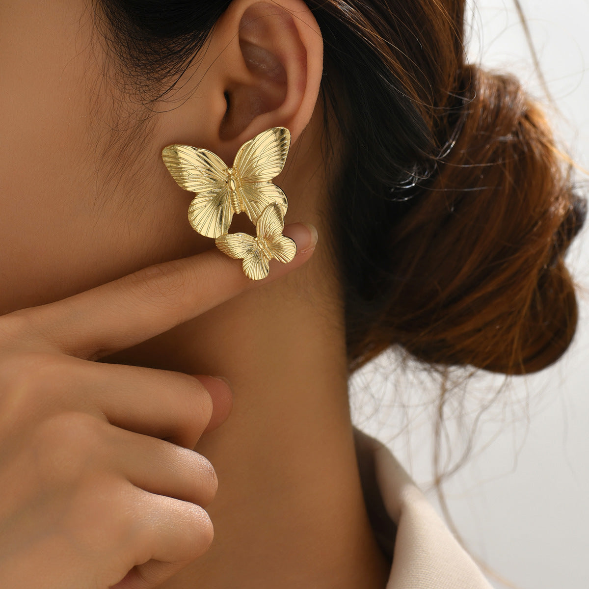 Mariah - Pendientes en forma de mariposa dorados