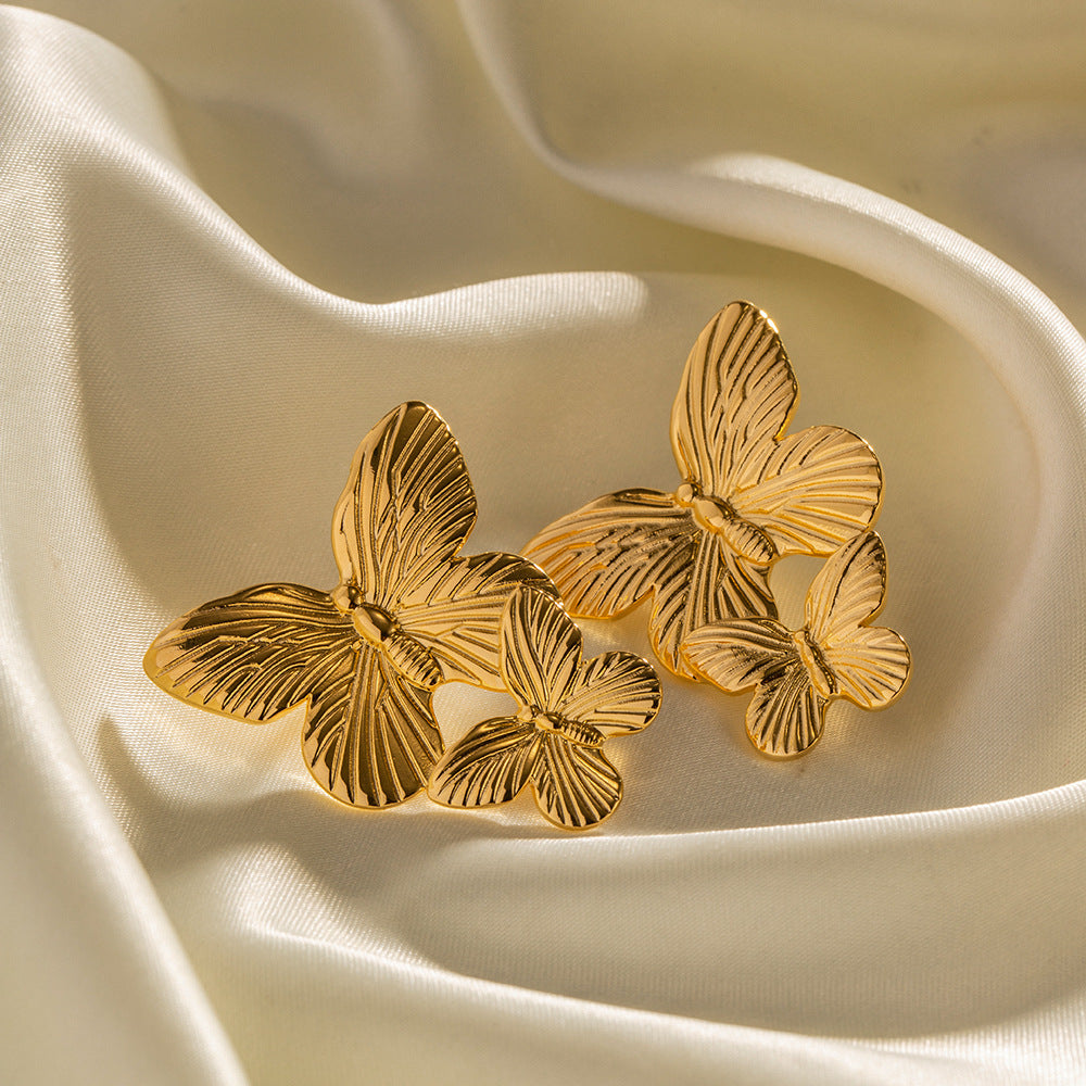 Mariah - Pendientes en forma de mariposa dorados