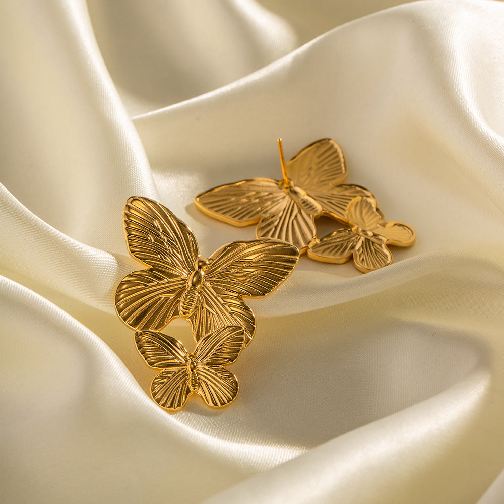 Mariah - Pendientes en forma de mariposa dorados