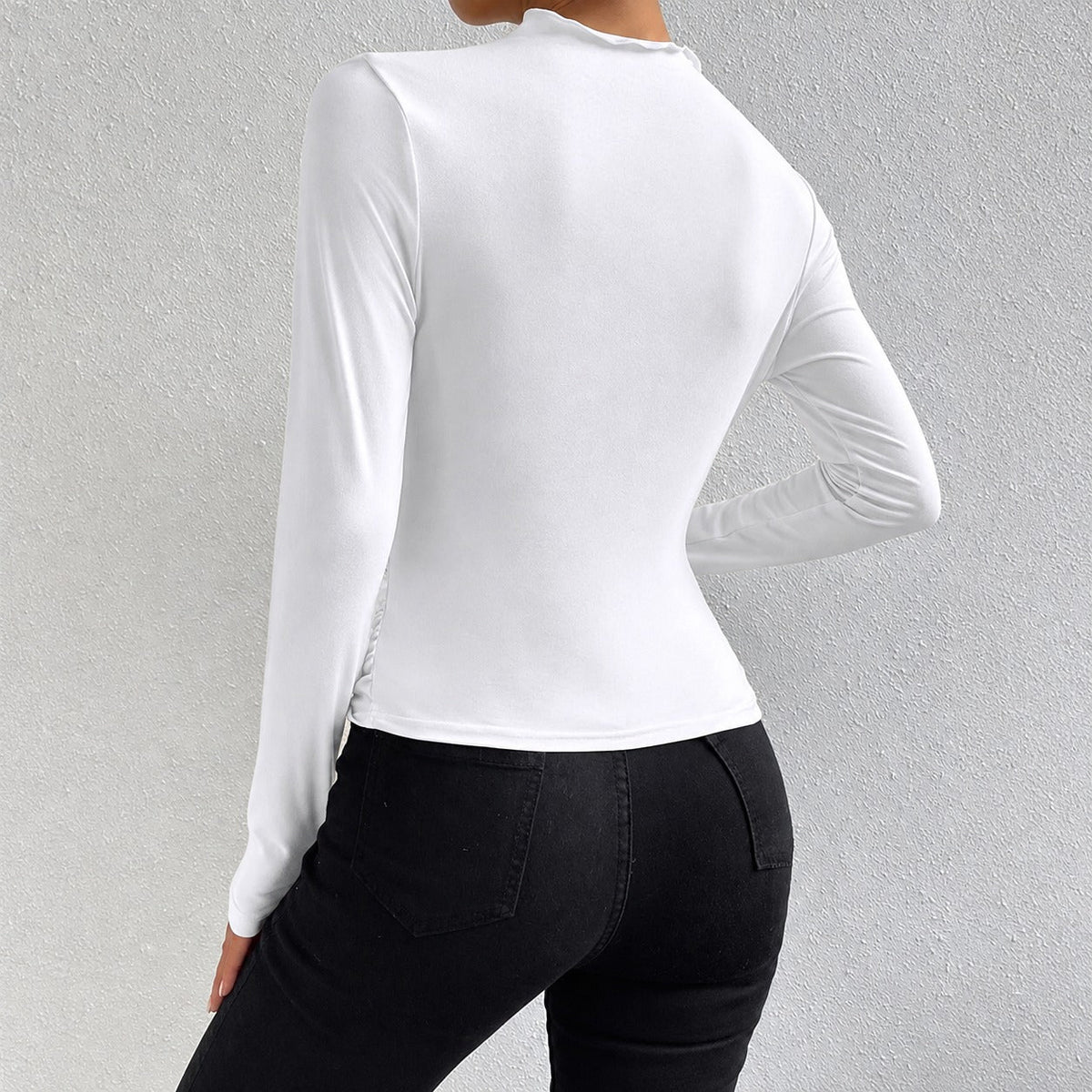 Livia - Camiseta de manga larga ajustada con volantes