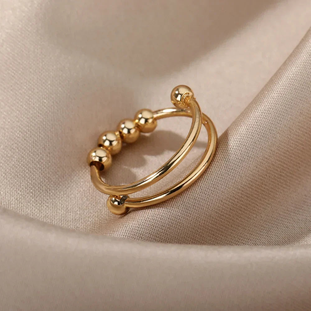 Maelis – Anillo antiestrés con perlas giratorias