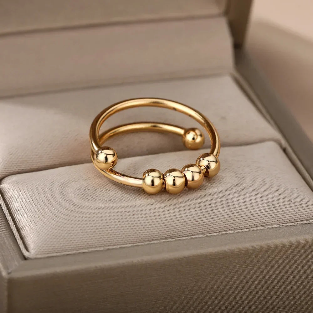 Maelis – Anillo antiestrés con perlas giratorias