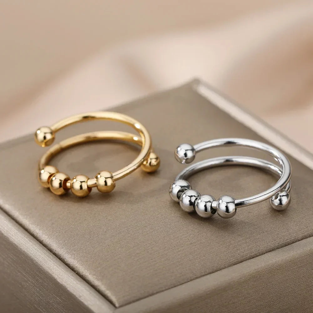 Maelis – Anillo antiestrés con perlas giratorias