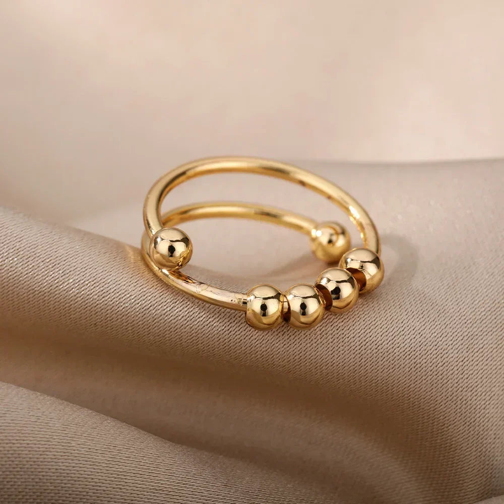 Maelis – Anillo antiestrés con perlas giratorias