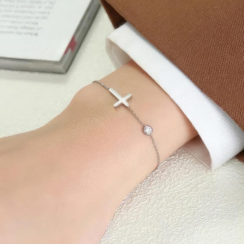 Althea – Pulsera con cruz para damas en oro y plata