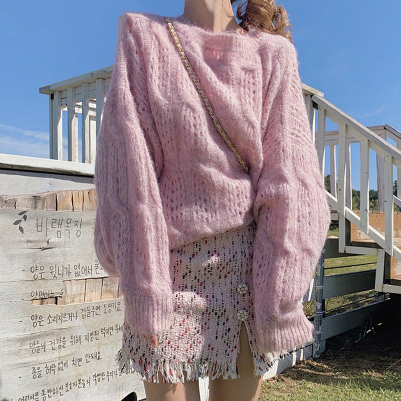 Suéter oversize de mujer con manga larga y detalle de abertura en el tejido